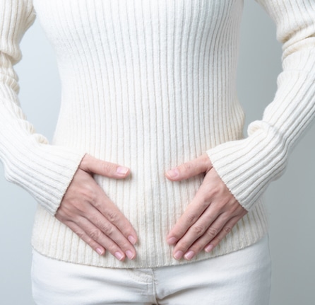 Woman holding her belly. Pregnancy, Reproductive system, menstruation, and gynecology concept